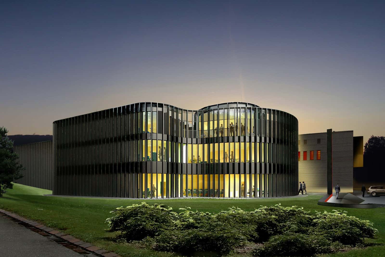 Night render of a curved office building wrapped in dark vertical metal fins with warm light glowing through the glazing