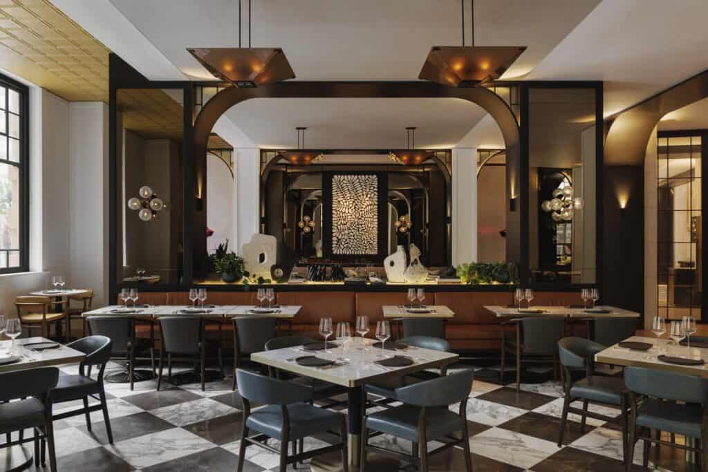 Brasserie 1930 at Capella Sydney with black-and-white marble floor, arched bar and dining tables