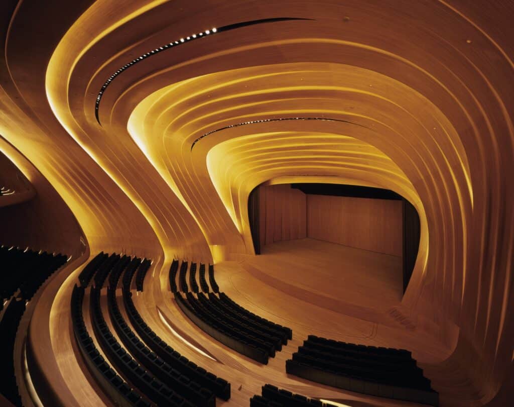 Overhead view of the empty oak-clad auditorium and terraced seating at the Heydar Aliyev Center