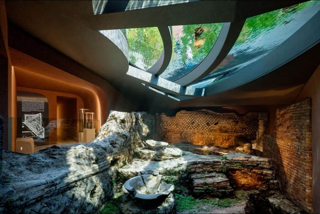Underground archaeological gallery at Hotel Romeo Roma, Roman brick and opus reticulatum walls and stone remains lit beneath the curved glass floor of the garden pool