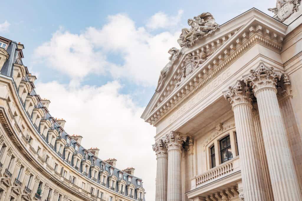 Neoclassical stone facade and columns of La Bourse de Commerce, Paris.
