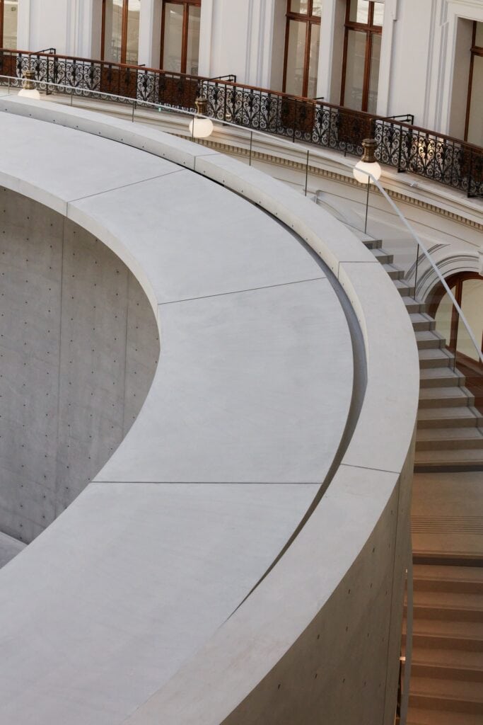 Curved concrete walkway along the top of the cylinder at La Bourse de Commerce
